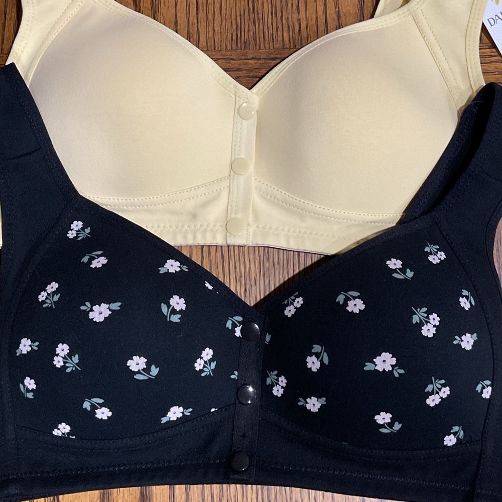 Pair of comfortable bras: cream & black with pink & green flowers snap closure M